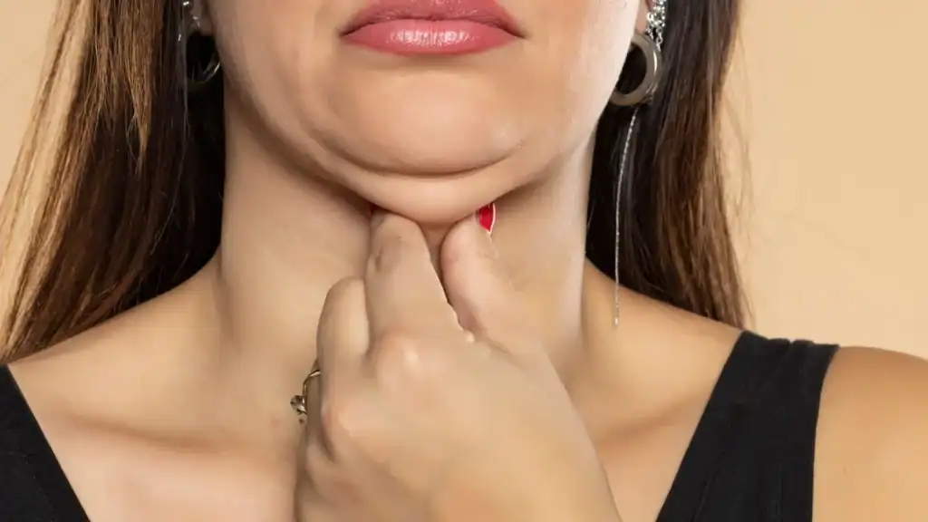 An image of a woman with double chin, sad, worried : Non Surgical Double Chin Removal Treatment in Diss, UK